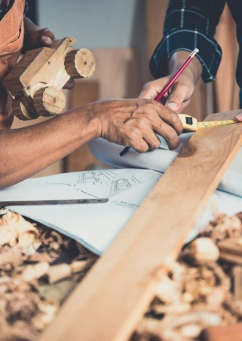 carpenter-working-on-woodworking-machines-in-carpentry-shop-1024x681